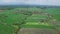 Aerial footage of asian rice fields and village