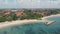 Aerial Footage of the beautiful Sanur Beach and the City in the background in Bali Indonesia