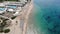 Aerial footage of the beautiful small town known as St George South, Greek city of Corfu Greece, showing people relaxing on the