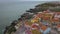 Aerial footage of a beautiful view overlooking the Rocky coast, houses and the houses of city Peniche, Portugal. Atlantic ocean, V