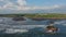 Aerial footage of black volcanic beach, green rice terraces. Bali, Indonesia