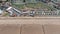 Aerial footage of the British seaside town of Hunstanton Norfolk, showing the coastal area and funfair rides with holiday makers