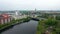 Aerial footage of busy multilane road on bridge over water and apartment buildings on Havel river waterfront. Town hall