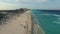 Aerial footage of Cancun beach. Drone flying above shore line with hotels