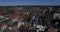 Aerial footage of the city roofs and canal in Netherlands. Drone flying above houses in Holland