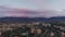 Aerial footage of Colourful sunset with clouds over the Almaty city near the mountain