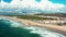 The Aerial footage of Costa da Caparica coastline of glorious sandy beaches, powerful Atlantic waves. Portugal