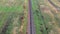 Aerial footage from a drone flying along a train track