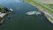 Aerial footage of a ferry arriving on the other side of the river