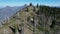 Aerial footage of the Glacier National Park Fire Lookout with towering mountains behind, Montana