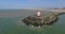 Aerial footage of lighthouse and beach shore. Drone aerial view of pier in Netherlands