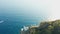 Aerial footage of a lighthouse and Ligurian Sea in Portofino, Italy