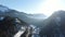 Aerial footage of a long footbridge between mountains, 4k