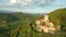 Aerial footage of medieval Rihemberk castle on top od a hill in green woods in Branik slovenia central europe