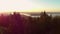 Aerial footage of a mountain viewpoint overlooking West Vancouver and downtown Vancouver at dawn.