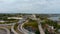 aerial footage of office buildings and skyscrapers along the Tennessee River with cars driving on the street and the Henley street