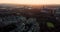 Aerial footage over Kelvingrove Park of the cityscape of Glasgow at sunset. Flying around the elegant buildings of Park Circus