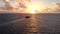 Aerial footage of a passenger and car ferry that goes between Isla Mujeres and Cancun in Mexico at sunrise.