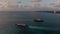 Aerial footage of a passenger and car ferry that goes between Isla Mujeres and Cancun in Mexico at sunrise.