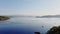 Aerial footage of the picturesque bay of the many islands near Marmaris at sunrise, lone sailing boats on the horizon