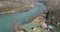 An aerial footage of a pure river, the shot is approaching the river