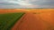 Aerial footage of ripe rapeseed ready for harvest from a bird`s eye view. Filmed in UHD 4k video