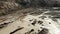 Aerial footage of the sand land, clay and stones, forward camera advance