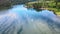 Aerial footage that showing a moving white boat on a lake