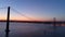 Aerial footage silhouette of 25th April bridge in twilight