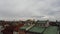 Aerial footage of the a typical street in KrakÃ³w Krakow Poland showing Renaissance style buildings in the main square on a cloudy