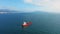 Aerial footage of ultra large cargo ship at sea, top down drone view.