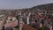 Aerial footage of urban neighbourhood in city on sunny day. Multistorey apartment houses and streets. Zurich