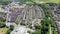 Aerial footage of the village of Cleckheaton in Yorkshire in the UK showing a view of a typical British housing estate, taken in a