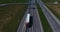 AERIAL: Freight truck transporting cargo container on a highway
