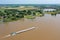 Aerial from a freighter cruising on the river Merwede in a flooded landscape in the Netherlands