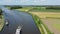 Aerial from freighters cruising in the countryside on Princes Margriet canal near Lemmer in the Netherlands