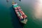 Aerial front view of a cargo ship carrying containers for import and export, business logistic and transportation in
