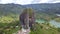 Aerial front view of Peck of Guatape, a large granite rock