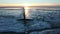 Aerial from a frozen Wadden Sea in winter in Friesland the Netherlands at sunset