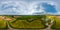 Aerial full seamless hdri 360 panorama over quarry flooded with water for sand extraction mining and rapeseed fields with sky and