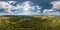 aerial full seamless spherical hdri 360 panorama view over meandering river and forest in sunny summer day and windy weather with