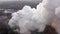 Aerial. GLOBAL WARMING. View of high chimney pipes with grey smoke.