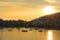 AERIAL: Golden evening sun rays illuminate the picturesque Albanian Riviera.