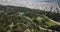 Aerial of Golden Gate park and lake in San francisco with cars traffic passing through