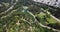 Aerial of Golden Gate park and lake in San francisco with cars traffic passing through