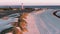 Aerial: Gorgeous sunset footage of Geraldton beach on west end and lighthouse in the background. Western Australia.