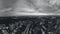 Aerial grayscale view, evening city streets pano