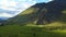 Aerial: Green Chulyshman Valley with a river, mountains. Altai