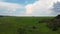 Aerial green wheat field landscape with scenic sky