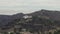 Aerial: Griffith Observatory far away with view on Hollywood Hills in Daylight, Los Angeles, California, Cloudy